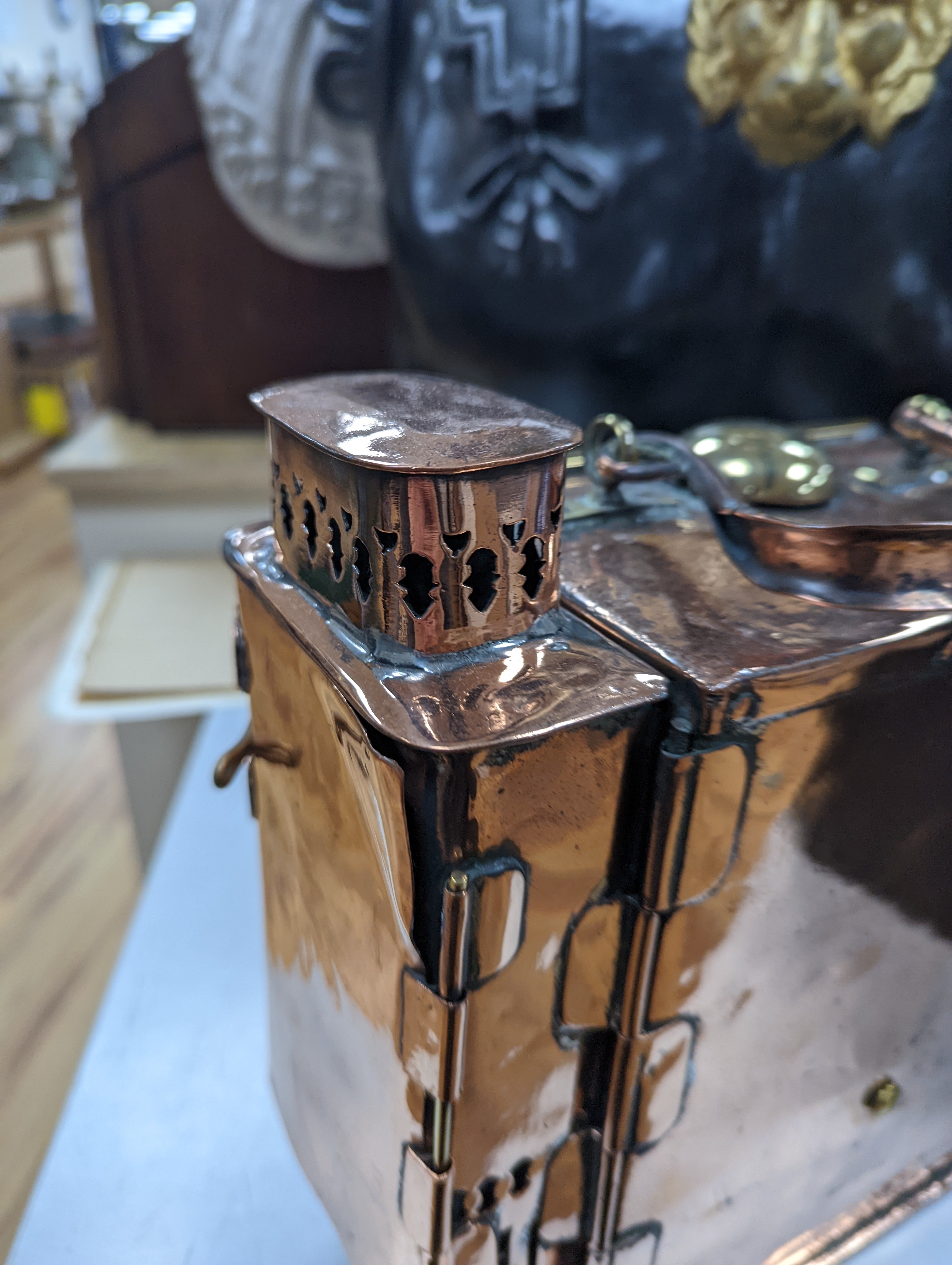 A copper ship's binnacle compass, a brass oil lamp, a brass jug and a copper kettle